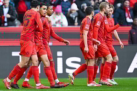 Bundesliga 2024-25: Bayern's players celebrate after scoring the opening goal
