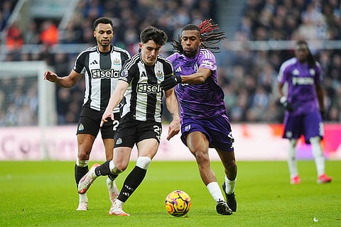 English Premier League 2024-25: Newcastle United's Tino Livramento and Fulham's Alex Iwobi battle for the ball