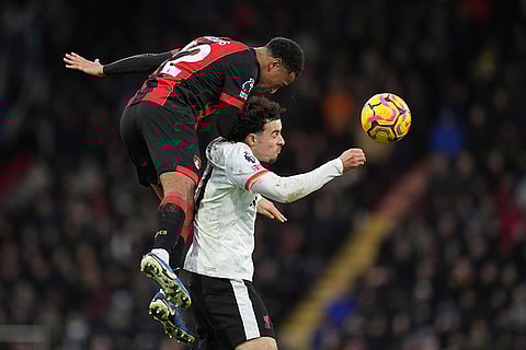 English Premier League 2024-25: Liverpool's Curtis Jones jumps for the ball with Bournemouth's Tyler Adams