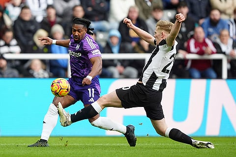 English Premier League 2024-25: Fulham's Adama Traore and Newcastle United's Lewis Hall battle for the ball