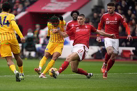 English Premier League: Nottingham Forest's Nikola Milenkovic blocks a shot from Brighton and Hove Albion's Joao Pedro
