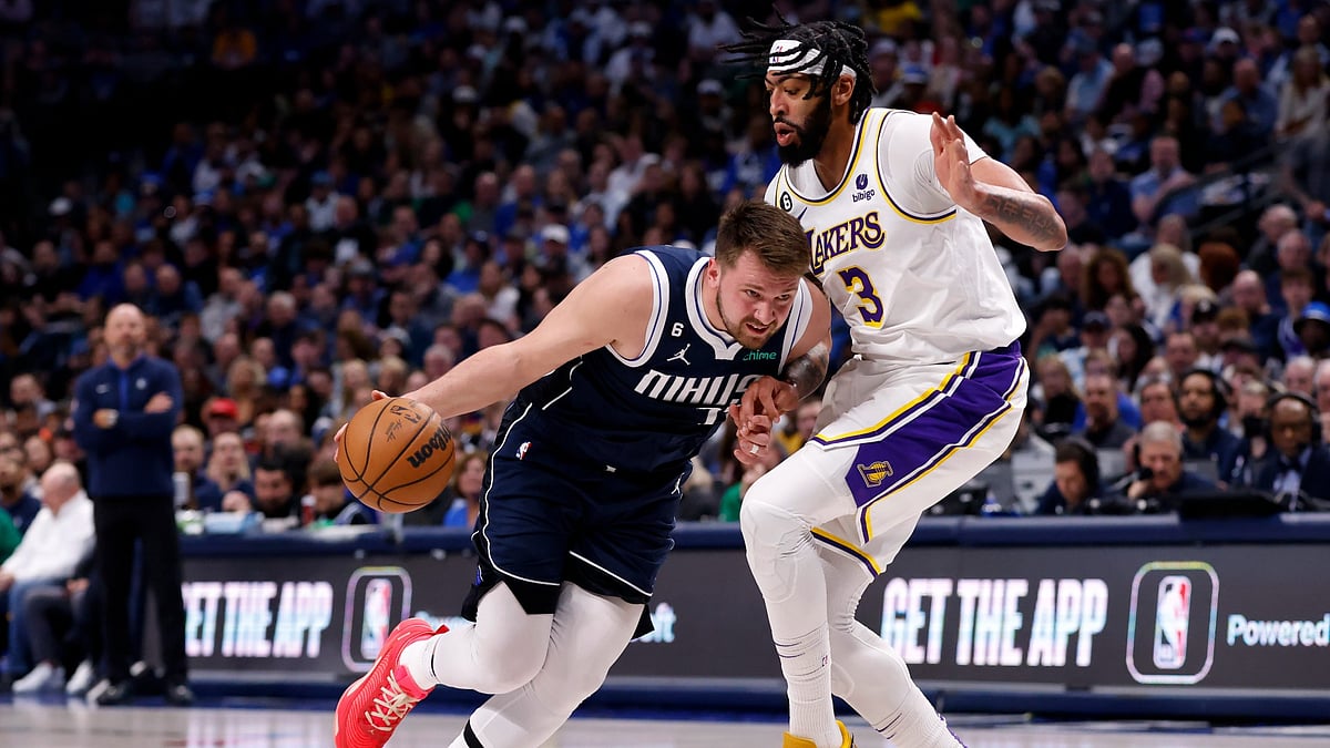 Luka Doncic #77 of the Dallas Mavericks handles the ball against Anthony Davis #3 of the Los Angeles Lakers in the first half of the game at American Airlines Center on February 26, 2023 in Dallas, Texas.