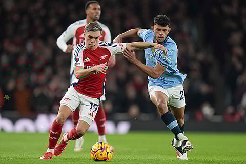 English Premier League 2024-25: Arsenal's Leandro Trossard, left, and Manchester City's Matheus Nunes vie for the ball 