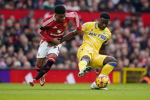 English Premier League 2024-25: Manchester United's Amad Diallo and Crystal Palace's Marc Guehi vie for the ball
