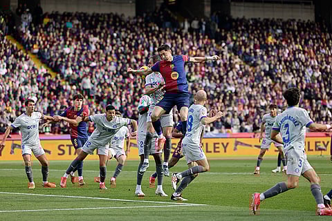 La Liga 2024-25: Barcelona's Robert Lewandowski jumps for the ball