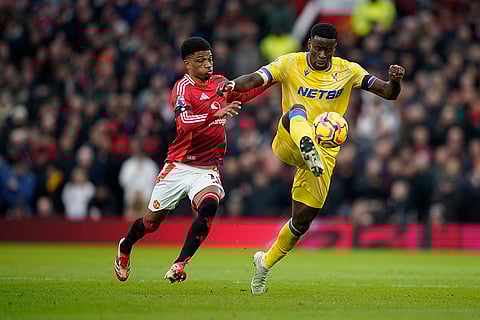 English Premier League 2024-25: Crystal Palace's Marc Guehi is challenged by Manchester United's Amad Diallo