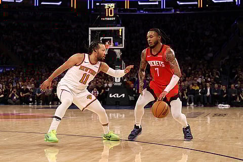 NBA 2024-25: Rockets' Cam Whitmore (7) dribbles the ball against Knicks' Jalen Brunson
