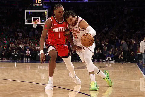 NBA 2024-25: Knicks' Jalen Brunson dribbles against Rockets' Amen Thompson