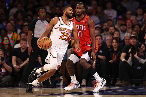 NBA 2024-25: Knicks' Mikal Bridges (25) dribbles the ball against Rockets' Tari Eason