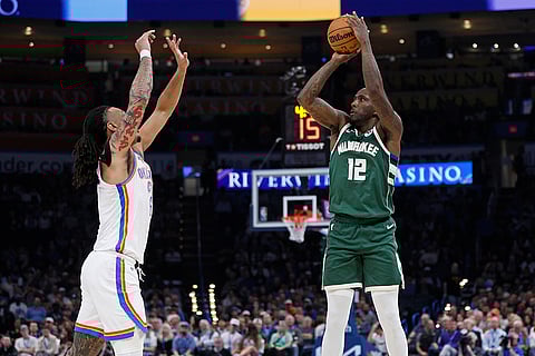 NBA 2024-25: Milwaukee forward Taurean Prince (12) looks to shoot over City forward Jaylin Williams