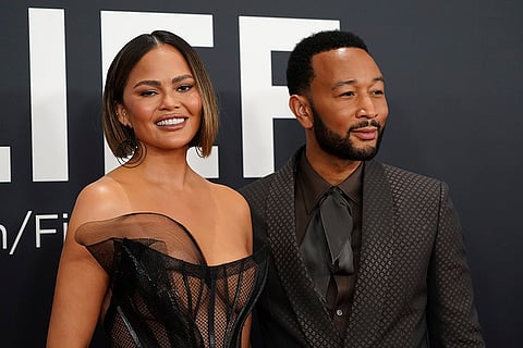 Chrissy Teigen, left, and John Legend