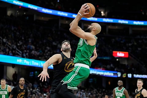 NBA 2024-25: Celtics guard Derrick White shoots over Cavaliers forward Georges Niang