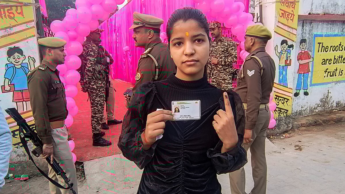 | PTI : Milkipur by-polls: First-time voter casts vote