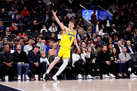 NBA 2024-25: Lakers guard Dalton Knecht celebrates after scoring a three-point basket