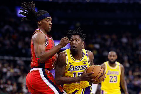 NBA 2024-25: Lakers forward Dorian Finney-Smith is defended by Clippers guard Terance Mann