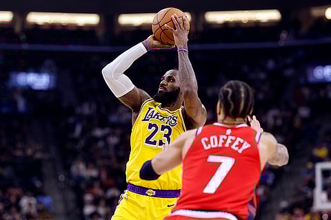 NBA 2024-25: Lakers forward LeBron James shoots basket against Clippers guard Amir Coffey