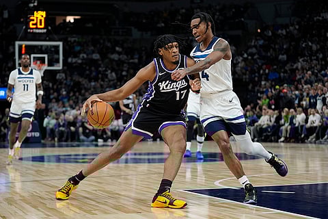 NBA 2024-25: Kings center Isaac Jones (17) works toward the basket