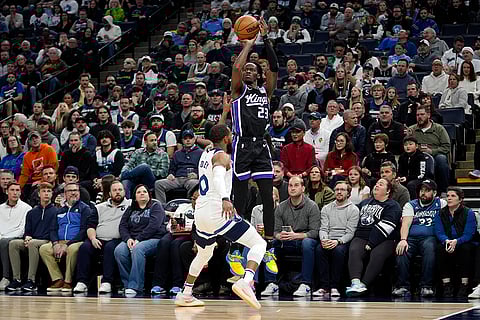 NBA 2024-25: Kings guard Keon Ellis (23) shoots over Timberwolves guard Mike Conley