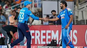 AP : Captains Jos Buttler, left, and Rohit Sharma shake hands after the first ODI between India and England.
