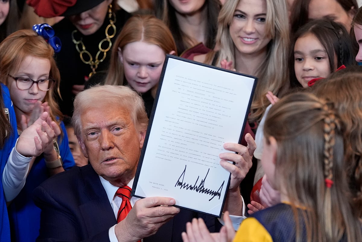 AP Photo/Alex Brandon : President Donald Trump signs an executive order barring transgender female athletes from competing in women's or girls' sporting events, in the East Room of the White House, Wednesday, Feb. 5, 2025, in Washington. 