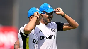 Aijaz Rahi/AP : India's Yashasvi Jaiswal, left, and Harshit Rana pose after they were presented with their ODI caps before the start of the first one day international cricket match between India and England at Vidarbha Stadium in Nagpur,