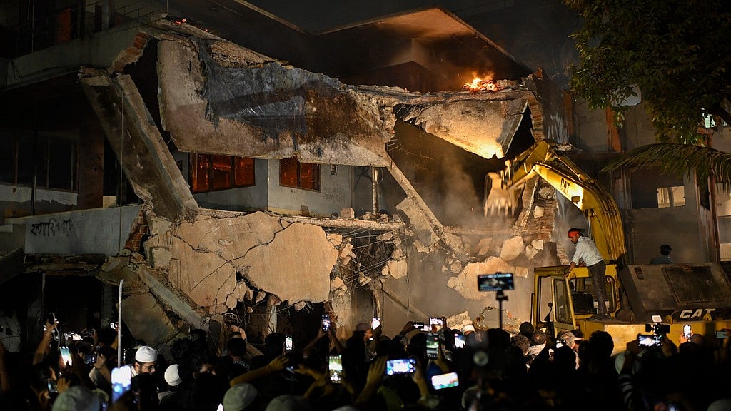 Protesters use heavy machinery to demolish the residence of Sheikh Mujibur Rahman, Bangladesh's former leader and the father of the country's ousted Prime Minister Sheikh Hasina, at Dhanmondi in Dhaka, Bangladesh, Thursday, Feb. 6, 2025.  - AP