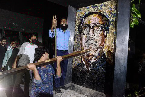 Bangladesh Protest: Protesters vandalize a portrait of Sheikh Mujibur Rahman