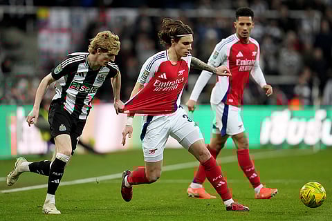 EFL Cup Semi-final: Newcastle's Anthony Gordon and Arsenal's Riccardo Calafiori challenge for the ball