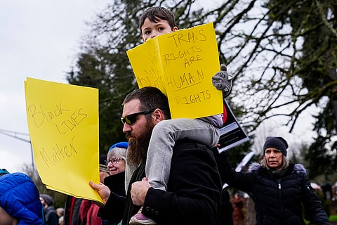 People gather to protest against the Trump administration