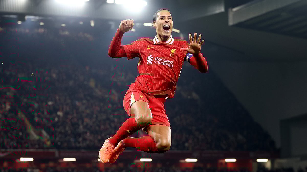 Virgil van Dijk celebrates after scoring against Tottenham - null