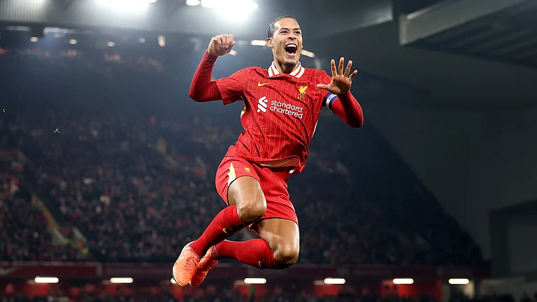 Virgil van Dijk celebrates after scoring against Tottenham - null