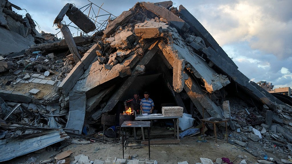 PTI : A man sells bread under the destruction of his bakery destroyed by the Israeli air and ground offensive in Jabaliya, Gaza Strip, Wednesday, Feb. 5, 2025.