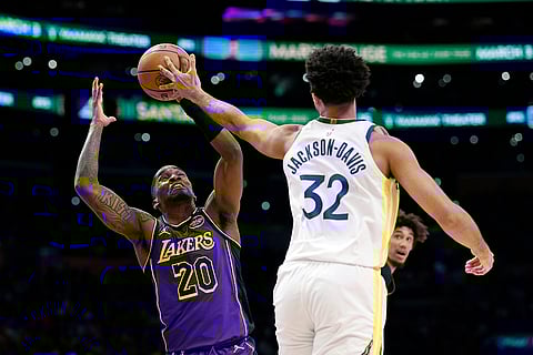 NBA 2024-25: Lakers guard Shake Milton and Warriors forward Trayce Jackson-Davis battle for the ball