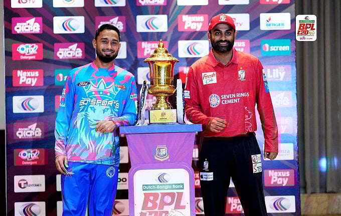 X/BCBCricket : Tamim Iqbal (R) with Mohammad Mithun with the BPL trophy.