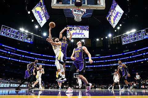 NBA 2024-25: Warriors guard Stephen Curry goes up for a layup against Lakers