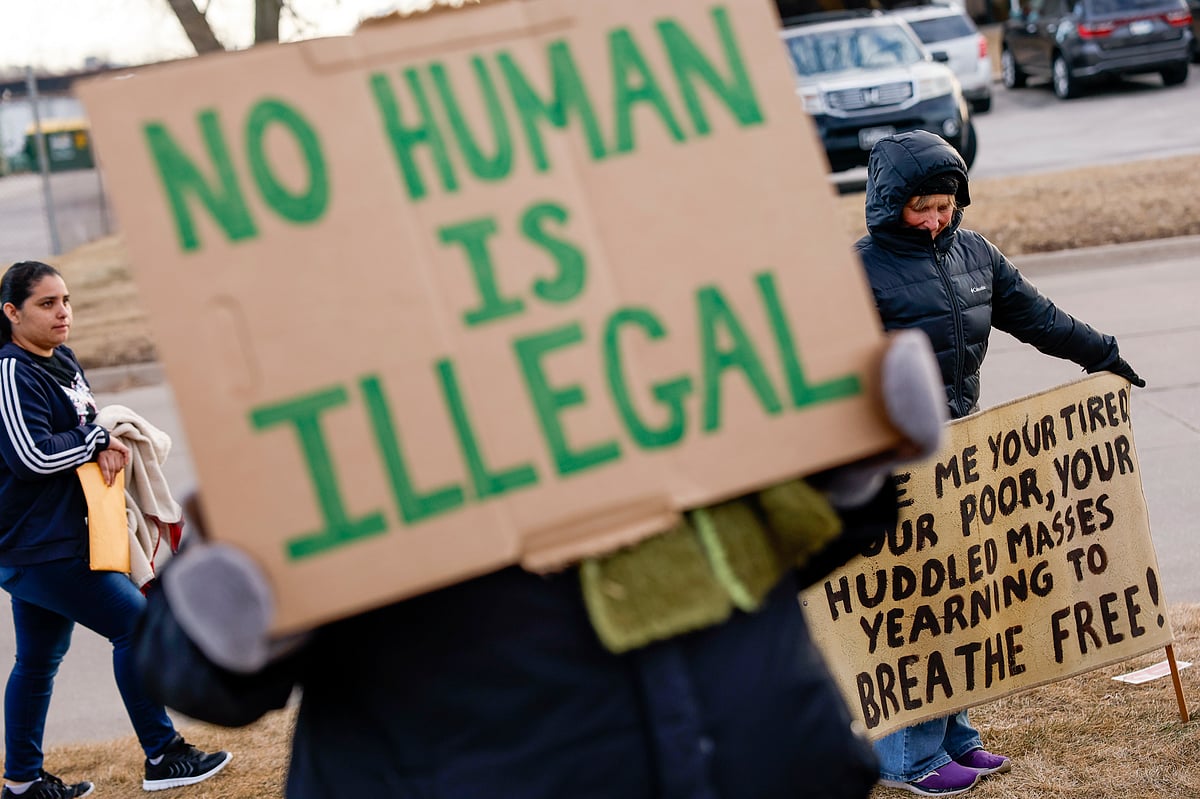Jim Slosiarek/The Gazette Via AP : Signs of support are seen during a protective accompaniment vigil as people arrive for their immigration appointments outside of the Cedar Rapids U.S. Immigration and Customs Enforcement (ICE) office in Cedar Rapids, Iowa, on Tuesday, Feb. 4, 2025. 