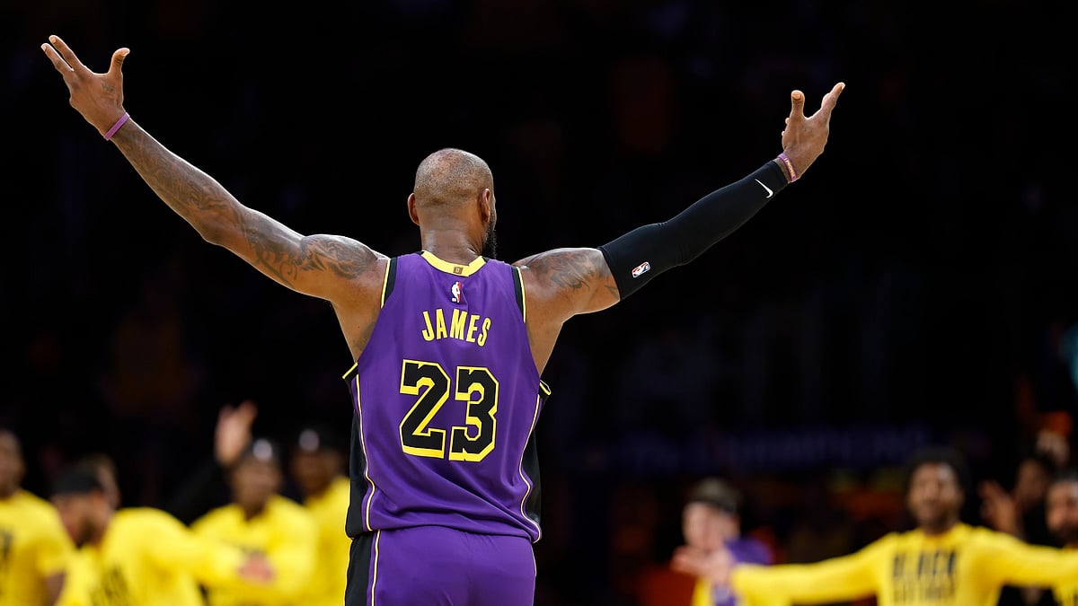 LeBron James #23 of the Los Angeles Lakers reacts after making a three-point shot against the Golden State Warriors in the first half at Crypto.com Arena on February 06, 2025 in Los Angeles, California.