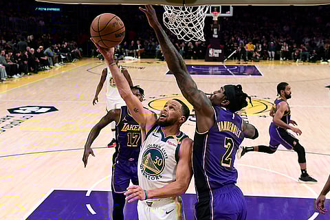 NBA 2024-25: Warriors guard Stephen Curry goes up for a layup against Lakers forward Jarred Vanderbilt