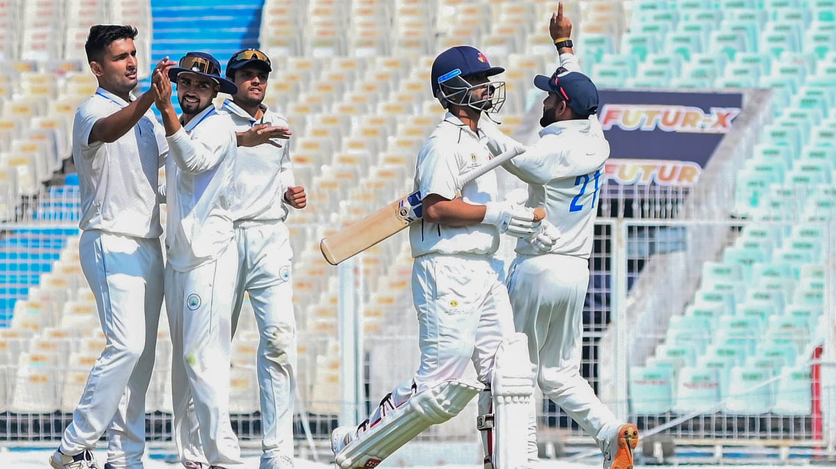 Photo: PTI : Haryana's Anshul Kamboj celebrates after taking the wicket of Mumbai captain Ajinkya Rahane on Day 1 of the Ranji Trophy quarter-finals.