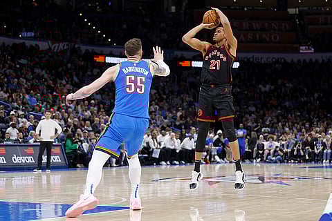 NBA 2024-25: Raptors center Orlando Robinson (21) looks to shoot over Thunder center Isaiah Hartenstein