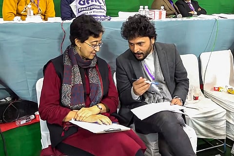 Atishi outside a counting centre