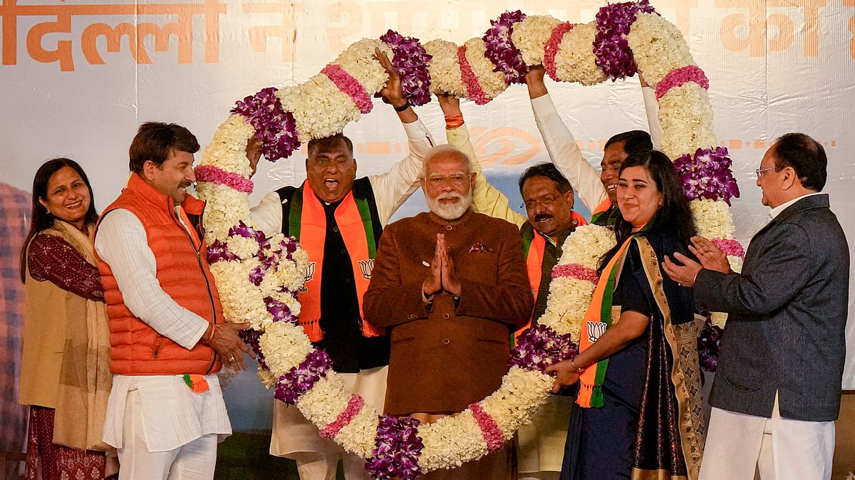 BJP celebrating victory. - PTI/Manvender Vashist Lav