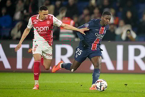 Ligue 1: Monaco's Vanderson, left, challenges PSG's Nuno Mendes