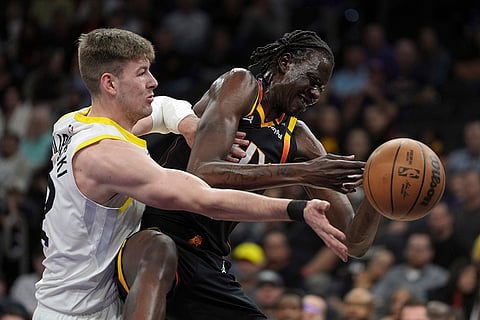 NBA 2024-25: Jazz forward Kyle Filipowski (22) fouls Suns center Bol Bol