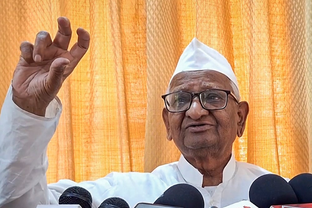 | Photo: PTI : Anna Hazare addresses media