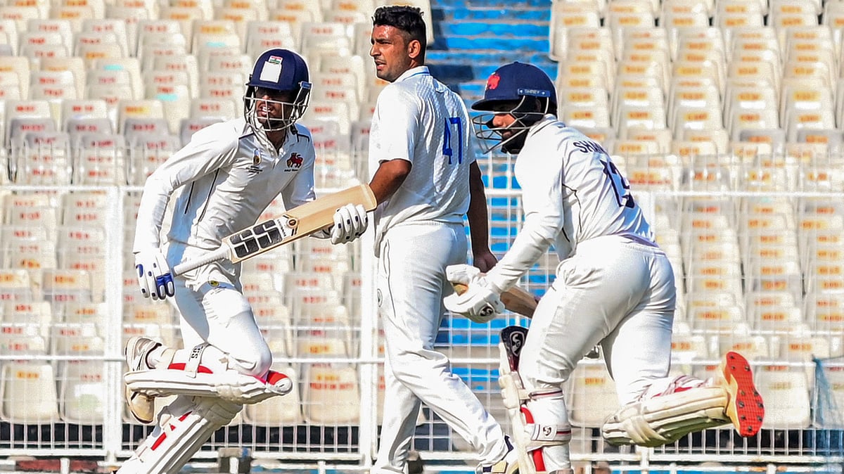 PTI : Shams Mulani and Tanush Kotian run between the wickets on the first day of the Ranji trophy quarter-final between Haryana and Mumbai.