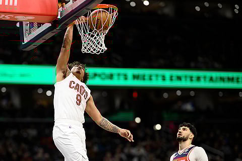 NBA 2024-25: Cavaliers guard Craig Porter Jr. (9) dunks past Wizards forward Tristan Vukcevic