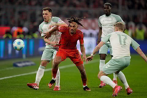 Bundesliga 2024-25: Bayern's Sacha Boey fights for the ball with Bremen's Senne Lynen