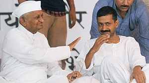 | Photo: PTI : Arvind Kejriwal with Anna Hazare (2011)