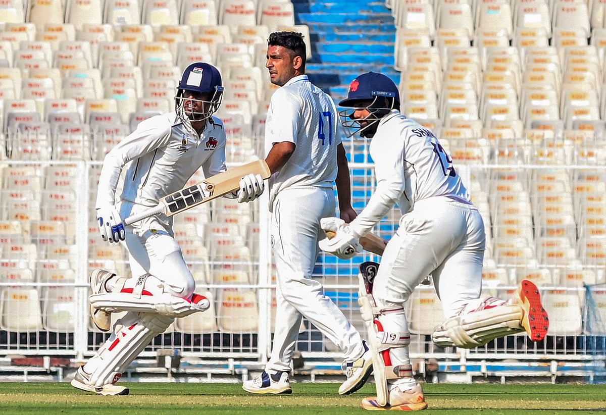 PTI : Mumbai's Shams Mulani and Tanush Kotian run between the wickets on the first day of a Ranji trophy quarterfinal cricket match between Haryana and Mumbai, at the Eden Gardens, in Kolkata, Saturday, Feb. 8, 2025.
